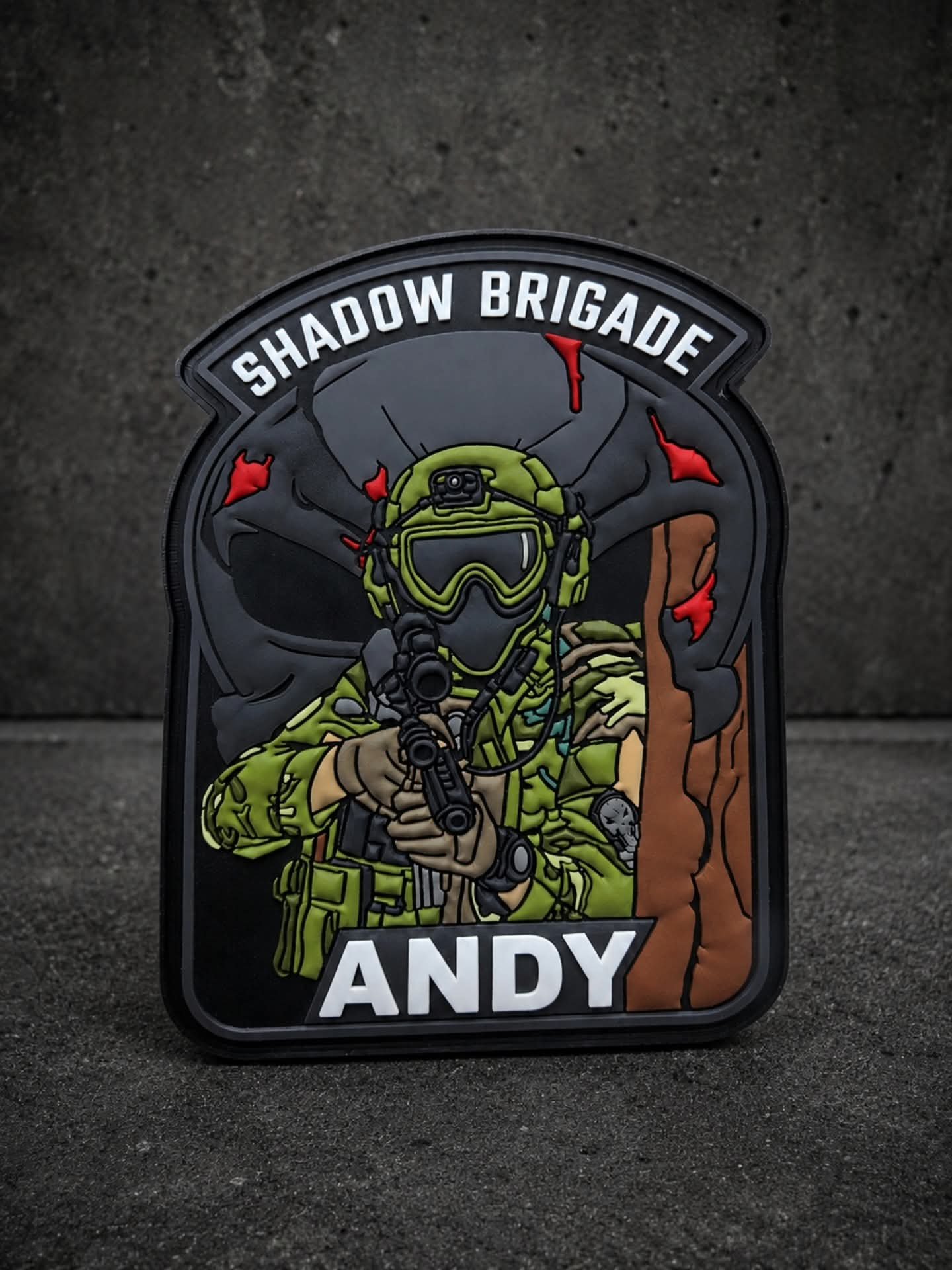 Custom Shadow Brigade PVC morale patch featuring a tactical soldier aiming a rifle with personalised name, made from durable 3D soft rubber for military and tactical gear. Custom Tactical PVC Morale Patch